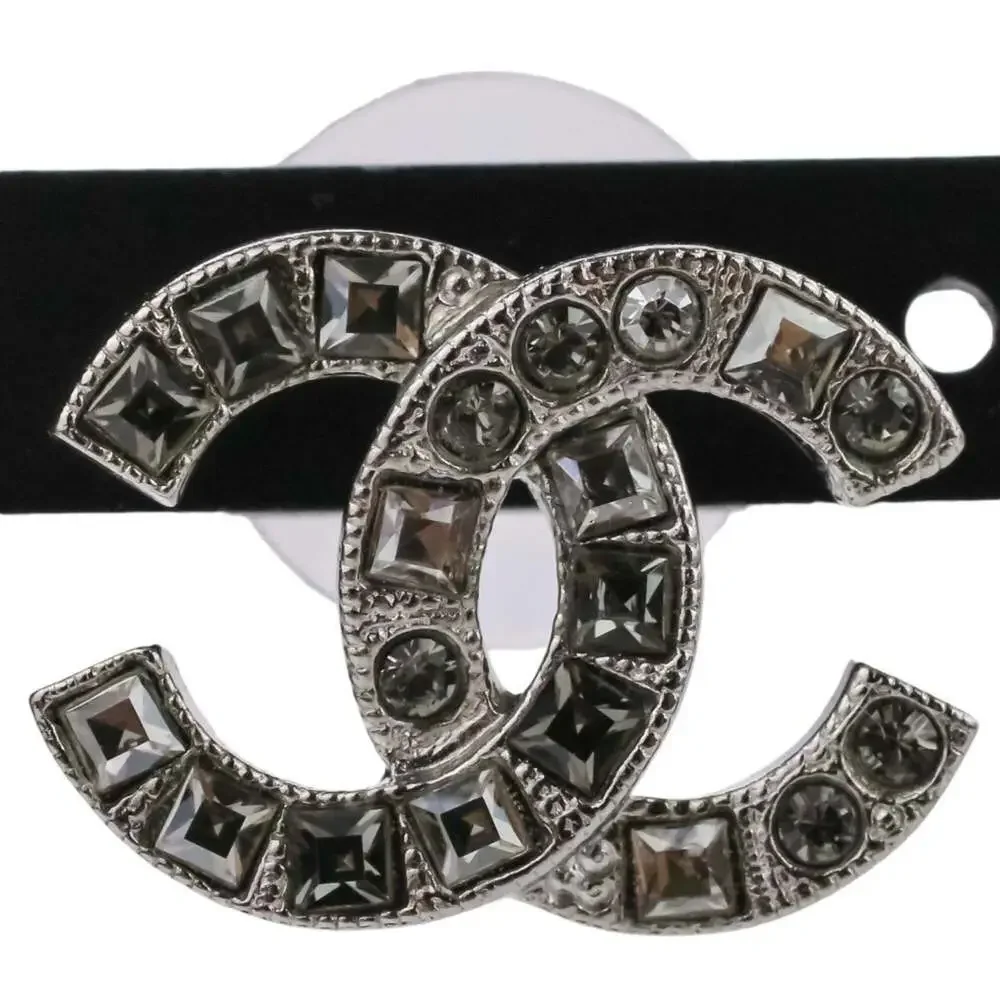 CHANEL Silver Logo Earrings